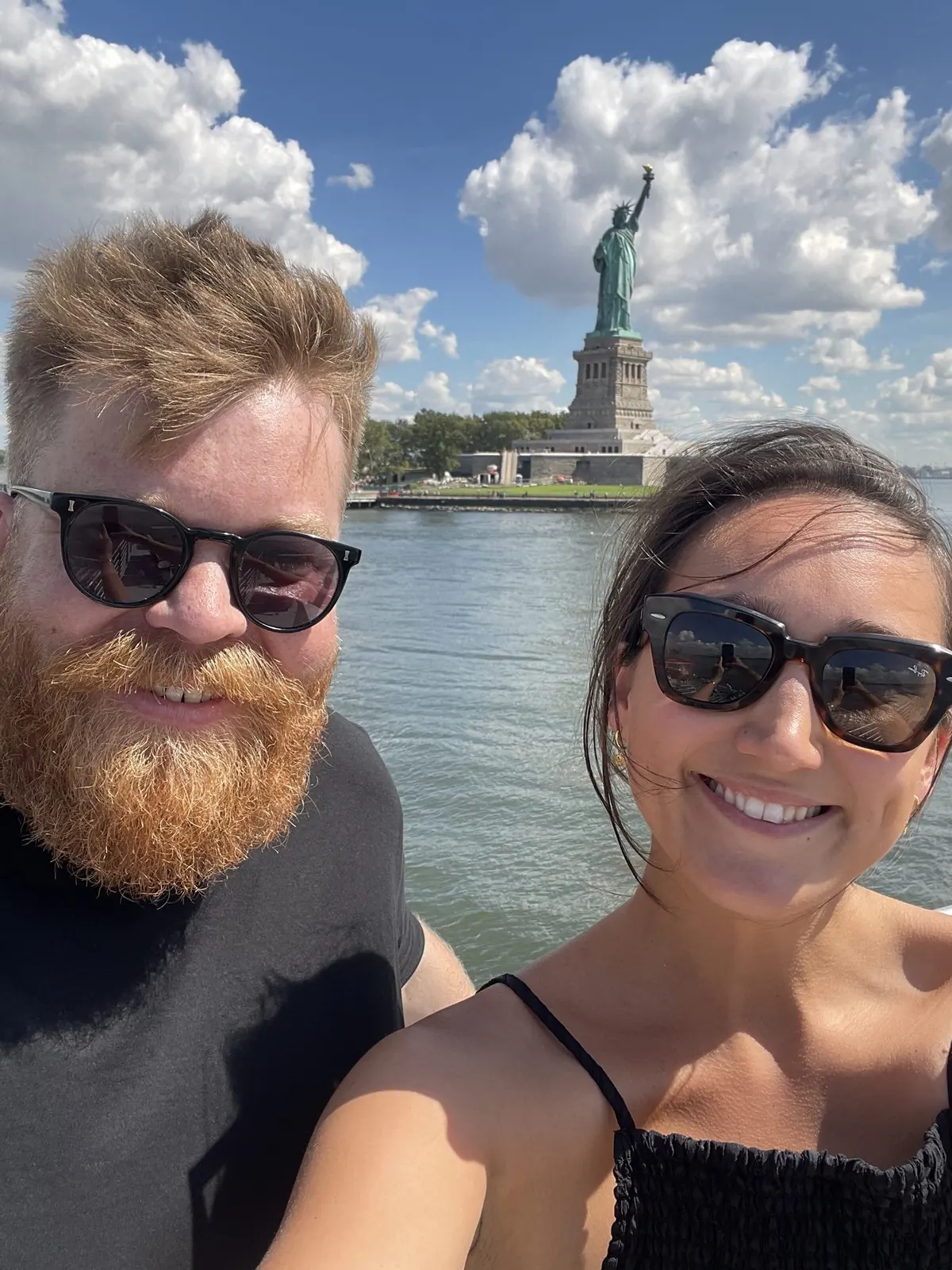 Lucie and Simon on the ferry past the Statue of Liberty, New York